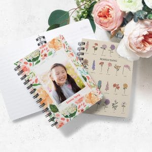 Floral inspired spiral notebooks laying on a desk