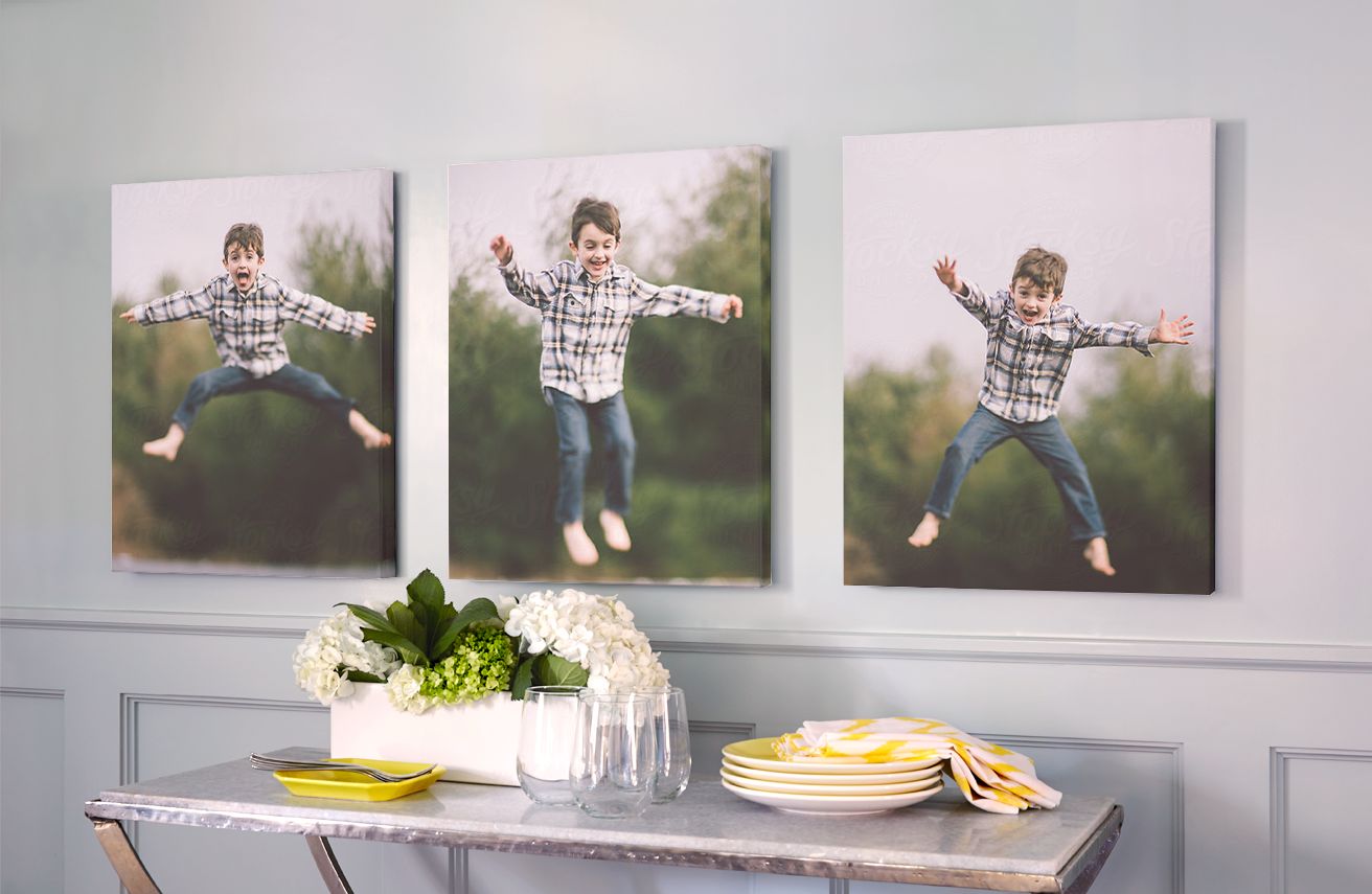 three pictures of a young boy on canvas prints above an entryway table